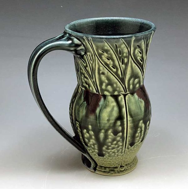 porcelain mug with leaf pattern in teal