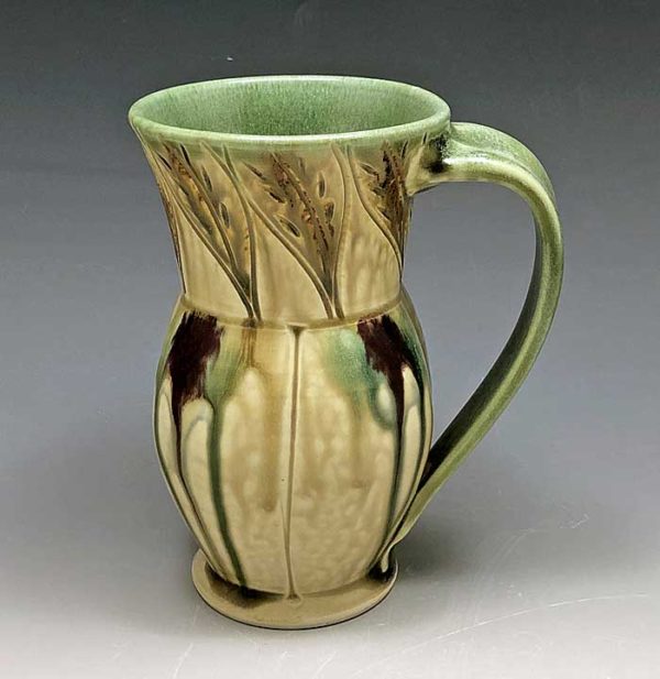 Carved porcelain mug with leaf pattern