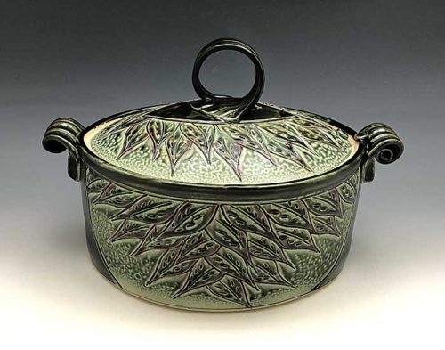 Oval stoneware casserole with leaf pattern by Ira Burhans