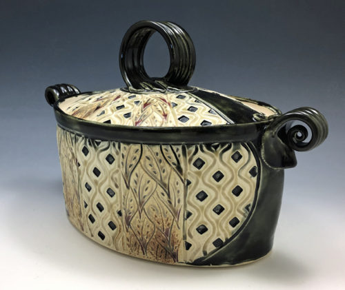 Black and Tan hand carved casserole by Ira Burhans